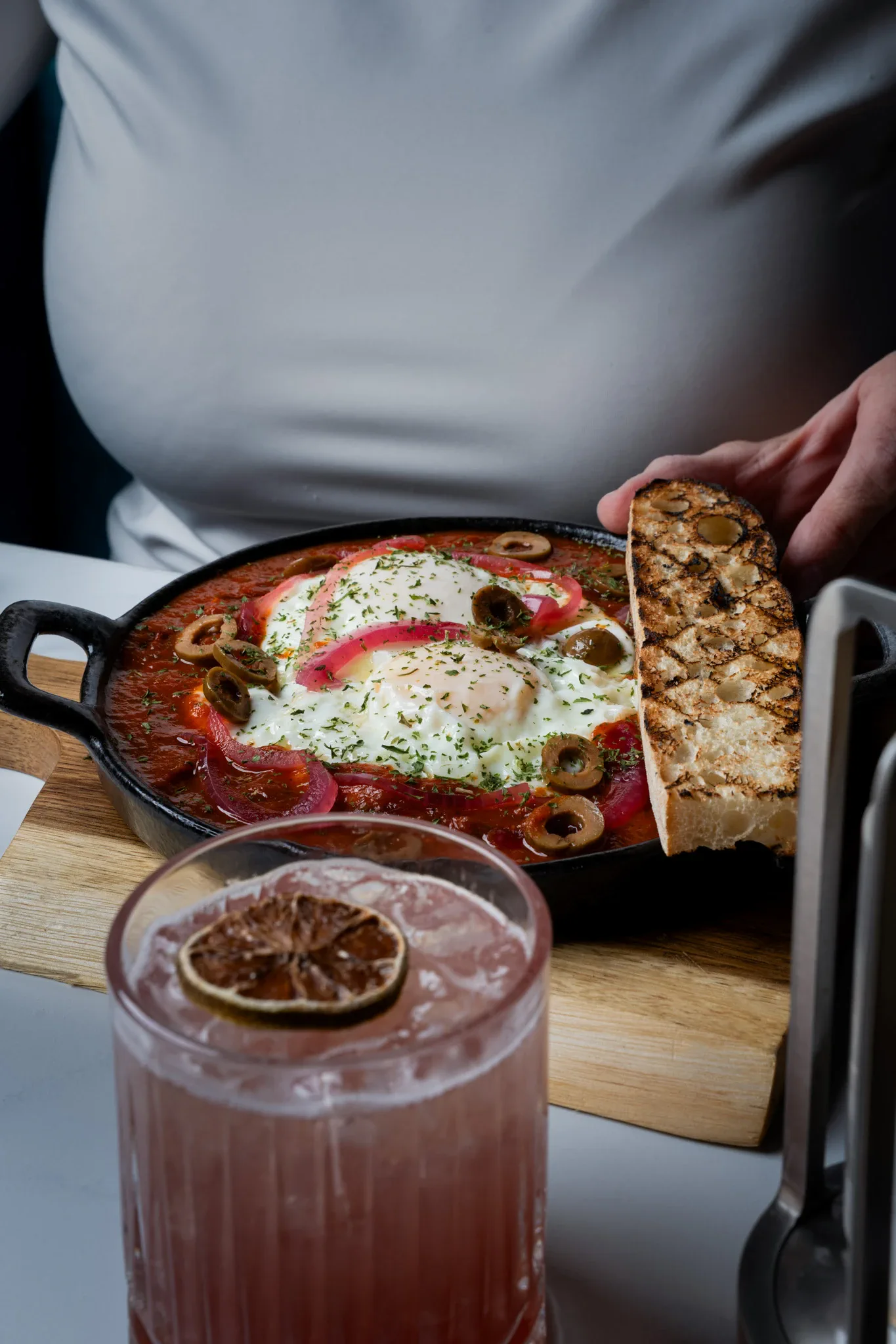 Baked eggs in San Marzano tomato sauce with grilled focaccia at Siena, Alpharetta