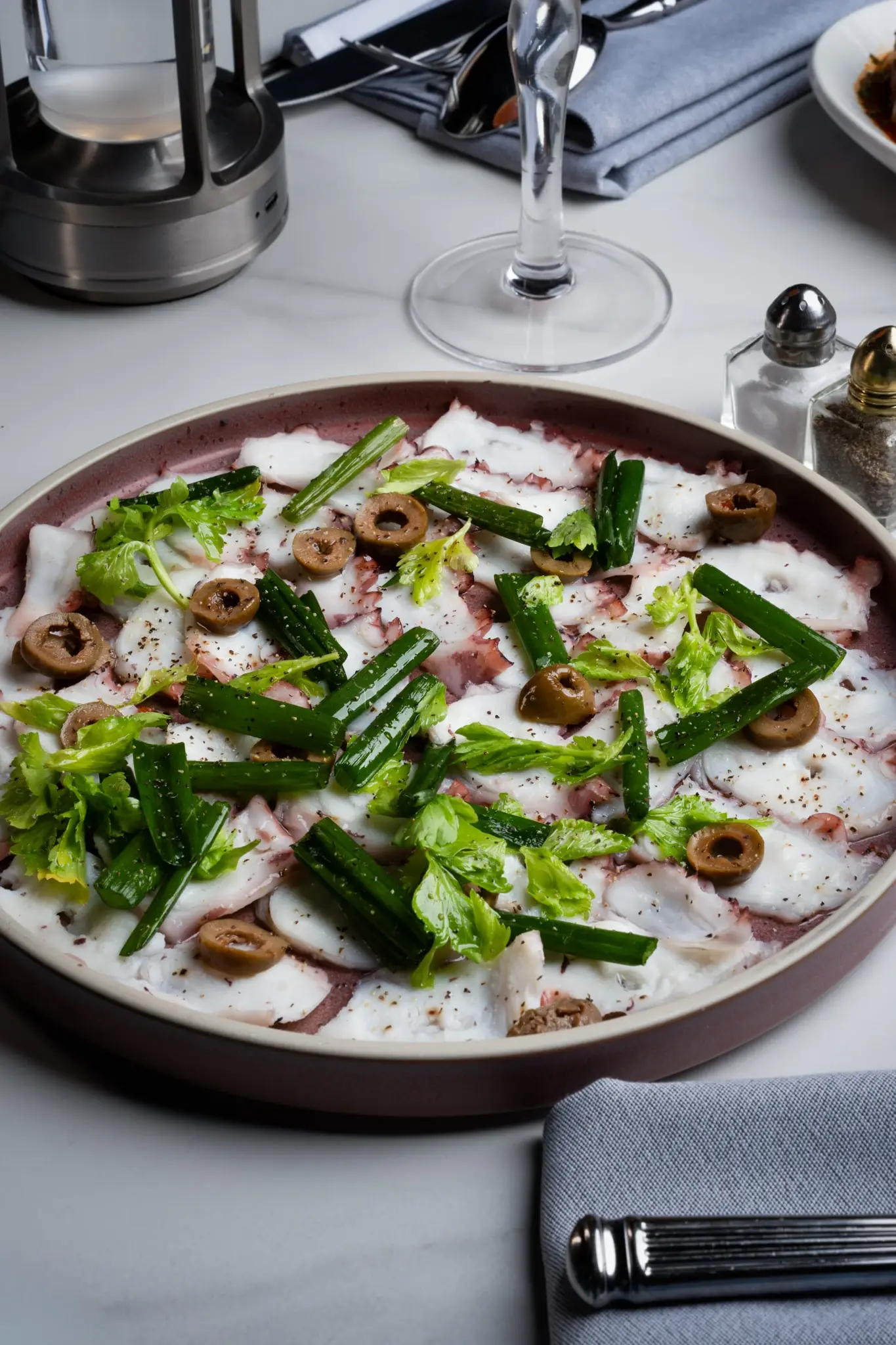 Octopus carpaccio with citrus oil, a lighter brunch plate in Alpharetta
