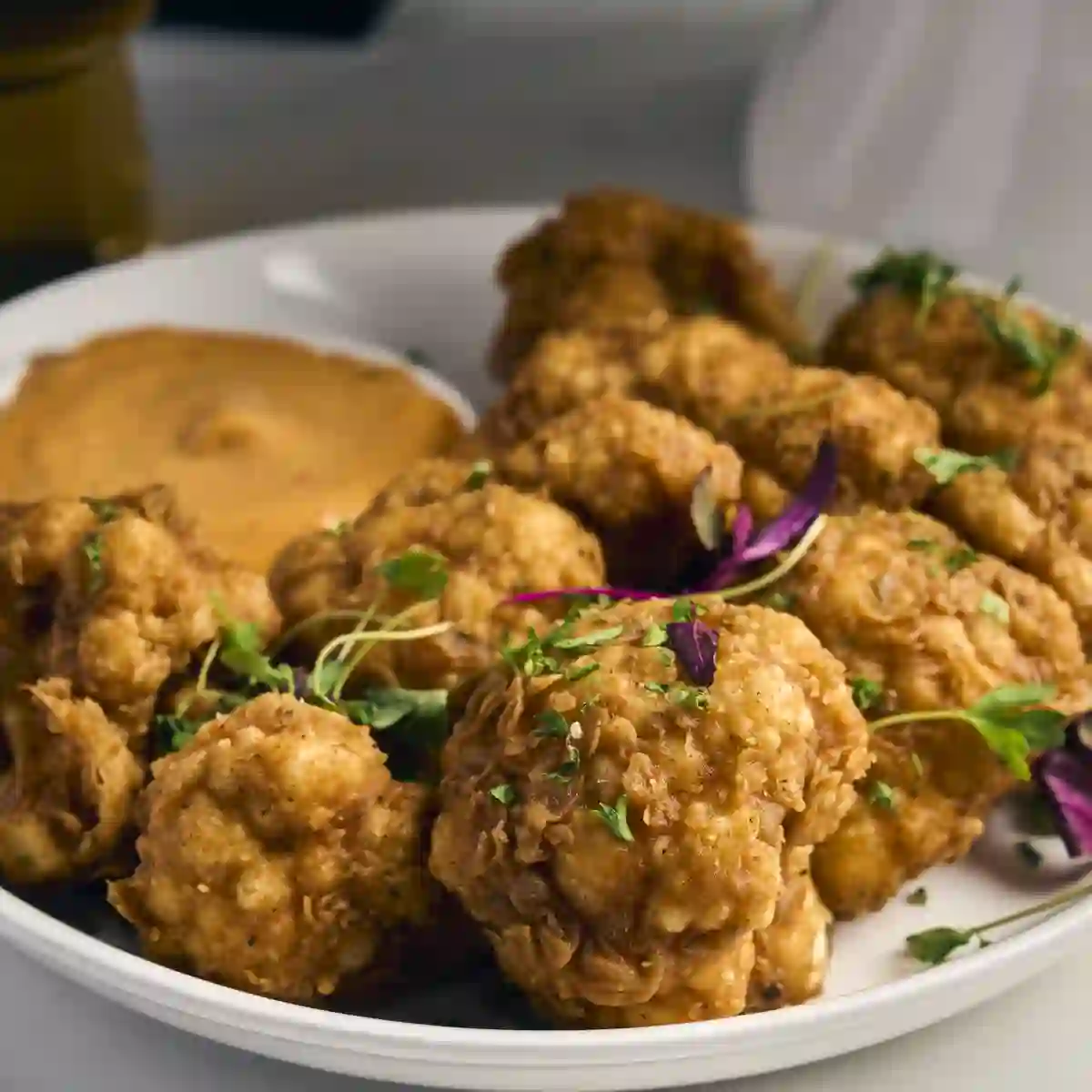 Crispy cauliflower with sweet chili aioli for the table at a private event at Siena, Alpharetta