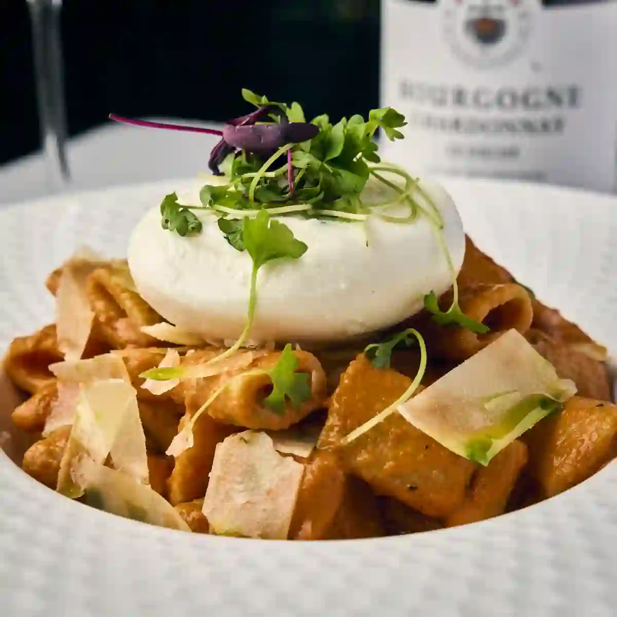 Rigatoni alla vodka topped with burrata, on the happy hour menu in Alpharetta